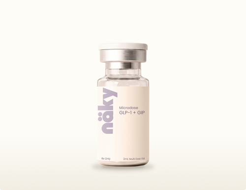 Compounded microdose tirzepatide multi-dose vial on a warm neutral background